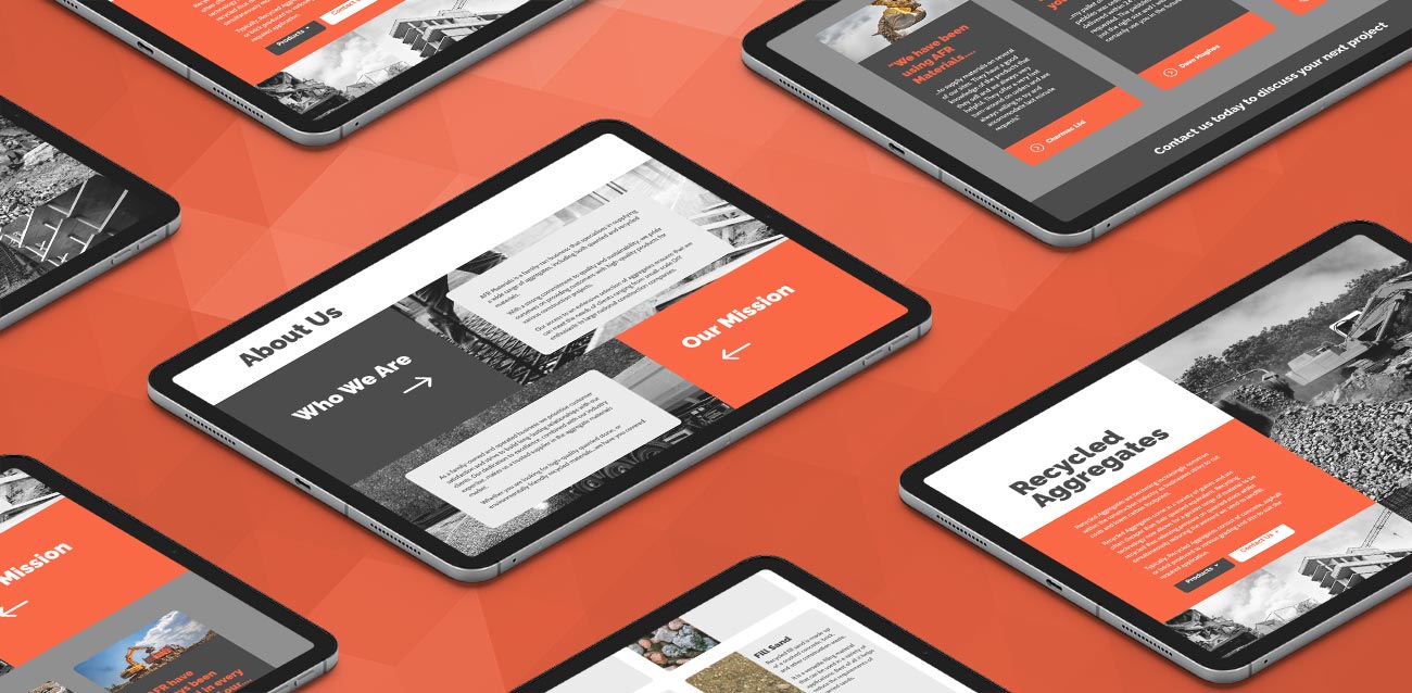 Various website pages displayed on digital tablets